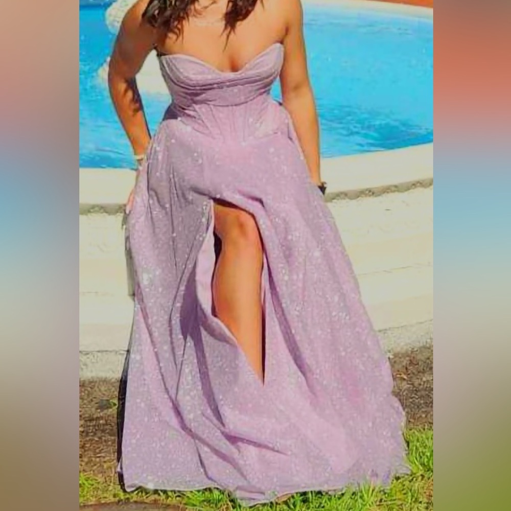 my senior prom dress,worn once for 6 hours. It has pockets and it has straps